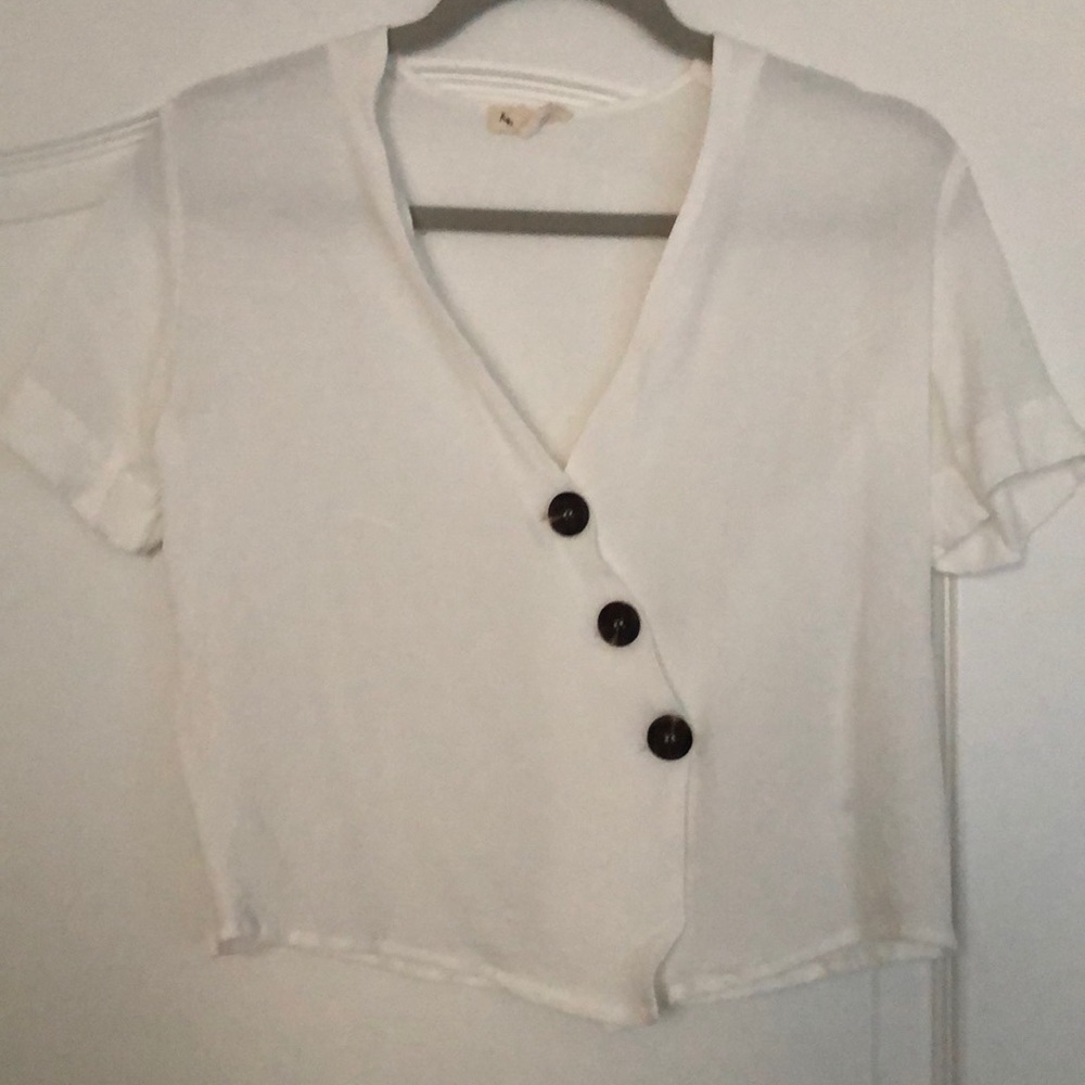 Asymmetrical button top
